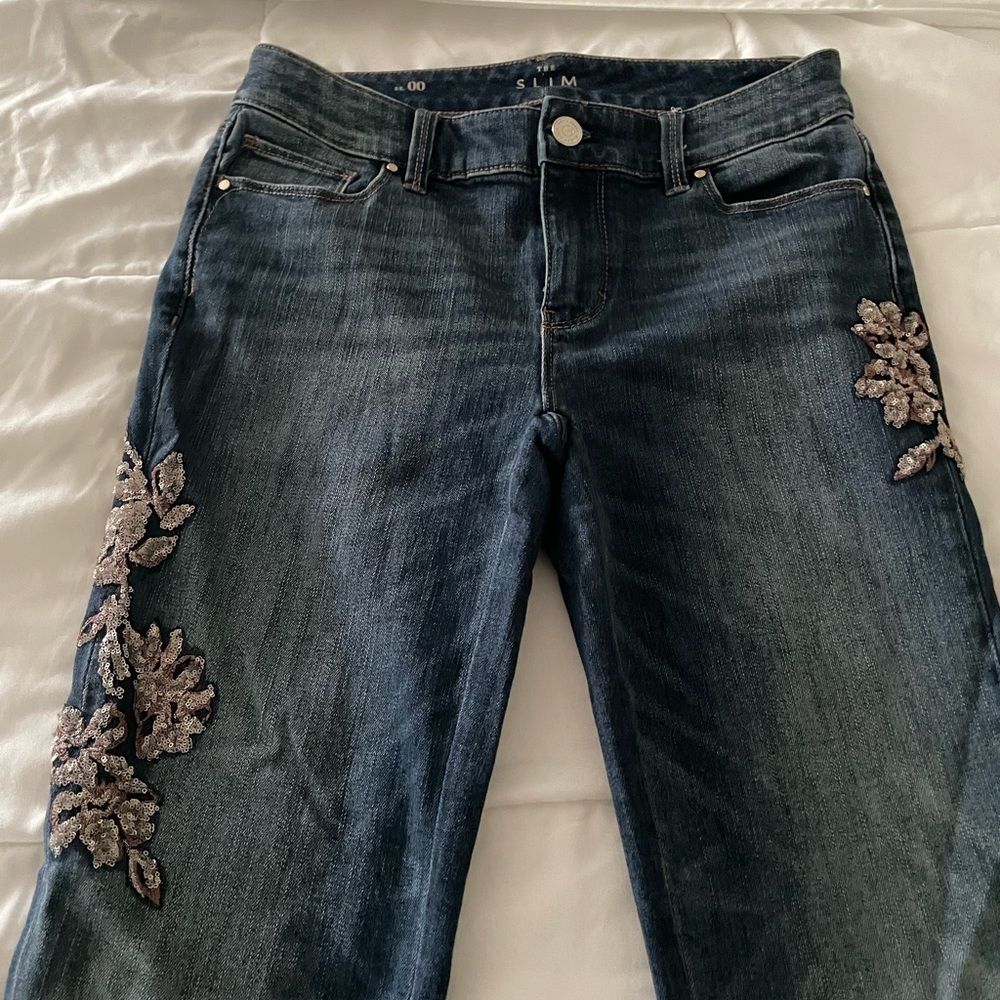 Embroidered on leg w gold and bronze  flower detailing